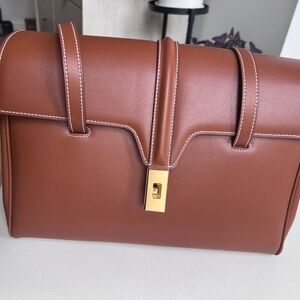 Elegant Brown Leather Handbag with Gold Accent